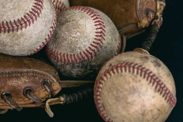 istock Vintage Baseball Catcher's Mitt with Baseballs 1458900668
