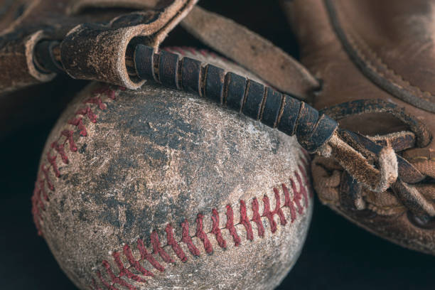 istock Vintage Baseball Catcher's Mitt with Baseball 1458900671