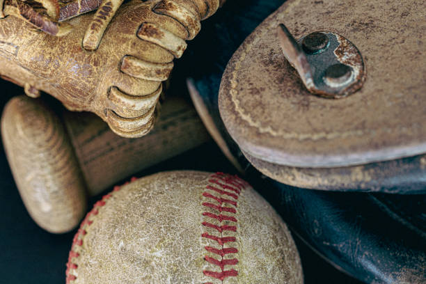 istock Vintage Baseball Cleats with Glove, Bat and Baseball 1458900706
