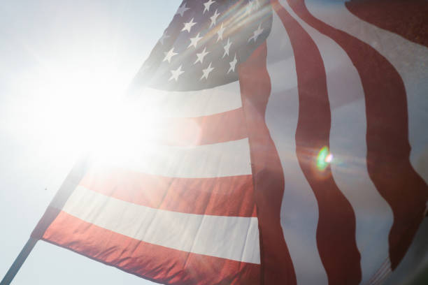 istock Sunflare with American flag in summer sunshine 1458900856