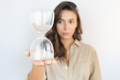 Young Woman Holding an Hourglass Aging in Lisbon, Lisbon, Portugal