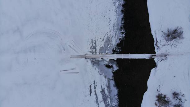 istock Icy River in Winter Look down Aerial Footage 1458902290