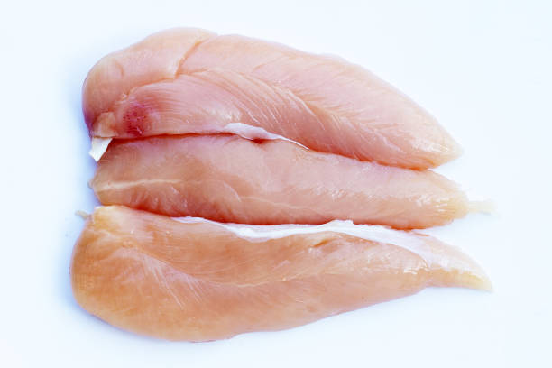 istock Raw chicken tenders on white background. 1458903905