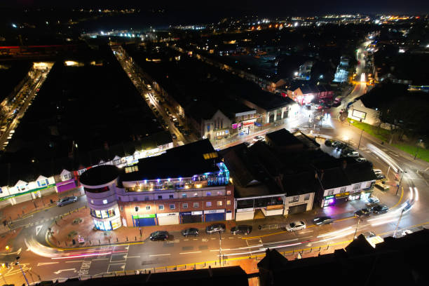 Illuminated View of Luton City of England UK During Night. Aerial View of Road and Traffic with Businesses at Night. Drone's Camera Footage was Captured on a Cold Night of 23rd January 2023