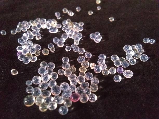 istock Clear beads like pearls on a black background 1458911808