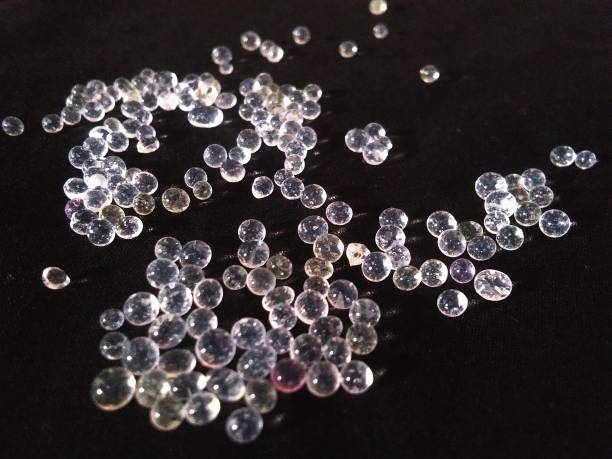 istock Clear beads like pearls on a black background 1458911941