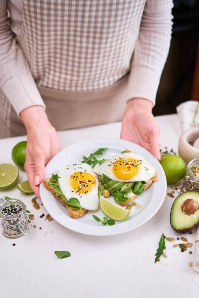 istock healthy breakfast or snack - sliced avocado and fried egg on toasted bread 1458914216