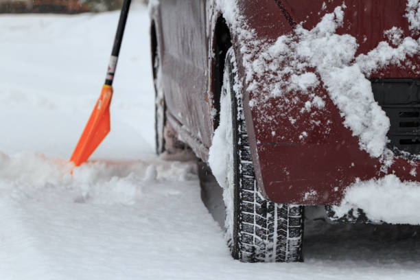 istock driving a car on a snowy road in winter 1458914542