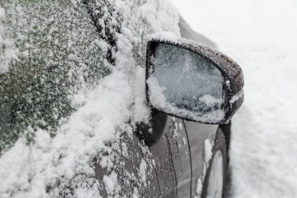 istock driving a car on a snowy road in winter 1458914570
