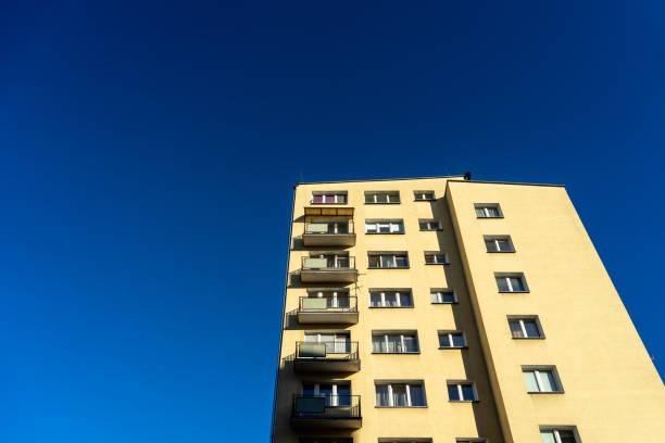 istock Looking up at the blue sky and tall buildings 1458916297