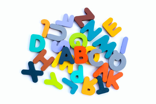 istock Colorful wooden alphabets on white background. 1458917145