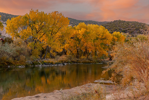 Rio Grande flowing through Embudo, Rio Arriba County, New Mexico in fall sunset