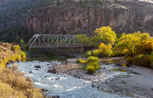John Dunn Bridge at the confluence of Rio Grande and Rio Hondo in Rio Grande Gorge, Arroyo Hondo, New Mexico in fall sunrise.