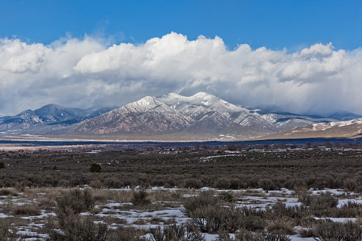 Taos Valley, New Mexico in winter with the snowy Sangre de Cristo Mountins.