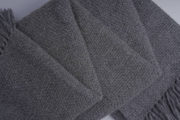istock Close up of folded waffle weave gray throw blanket 1458941509
