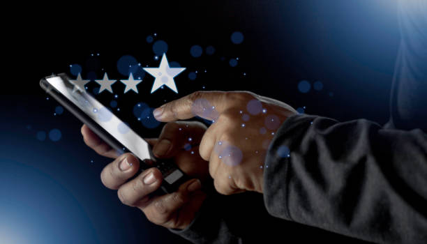 istock Satisfaction close up on customer man hand pressing on screen with five star rating feedback icon and press level excellent rank for giving best score point to review the service concept 1458944355