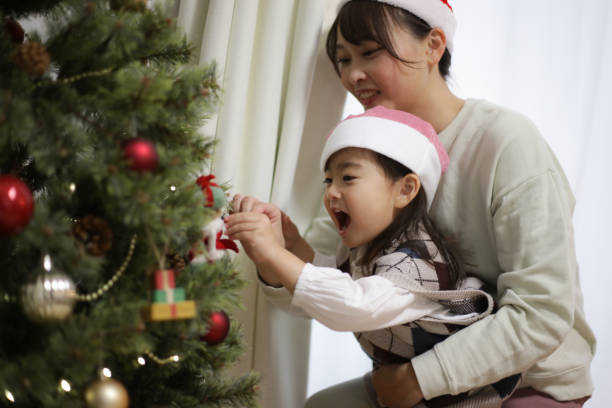 istock Parents and children with Christmas tree decorations 1458949046