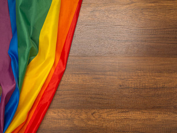 istock Rainbow or LGBT flag on a wooden background 1458951904