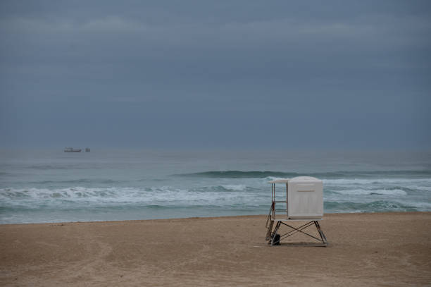 istock Empty beach with lifeguard hut seen on shore 1458957286