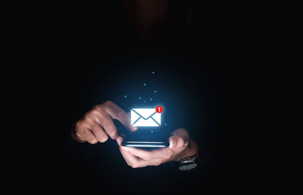 istock Hand of businessman using smartphone for email with notification alert. 1458962770