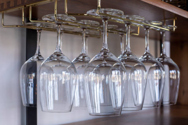 istock Wine glasses hanging up side down 1458962954