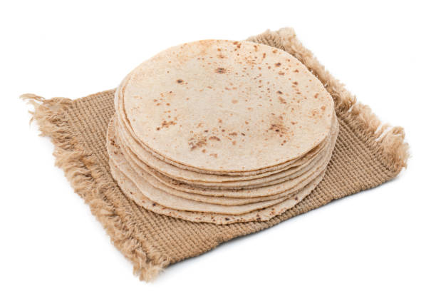 Indian Traditional Cuisine Chapati on White Background Indian Traditional Cuisine Chapati Also Know as Roti, Fulka, Paratha, Indian Bread, Flatbread, Whole Wheat Flat Bread, Chapathi, Wheaten Flat Bread, Chapatti, Chappathi or Kulcha on White Background taftan stock pictures, royalty-free photos & images