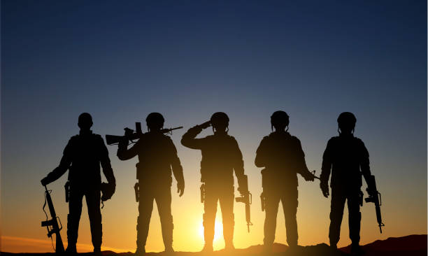 istock Military silhouettes of soldiers 1458973263
