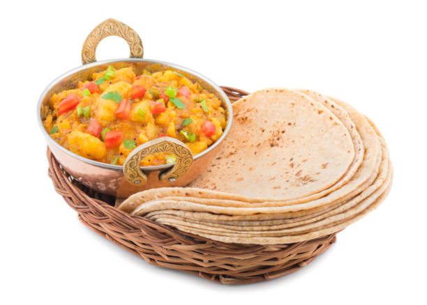 istock Indian Cuisine Spicy Fried Aloo Served with Indian Bread on White Background 1458973564