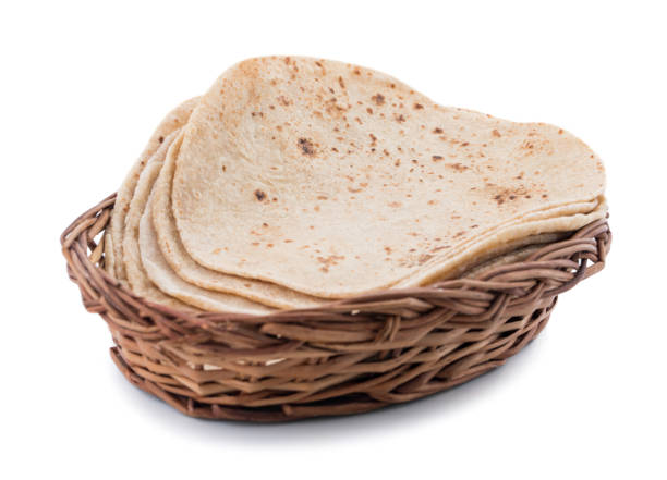 Indian Traditional Cuisine Chapati on White Background Indian Traditional Cuisine Chapati Also Know as Roti, Fulka, Paratha, Indian Bread, Flatbread, Whole Wheat Flat Bread, Chapathi, Wheaten Flat Bread, Chapatti, Chappathi or Kulcha on White Background taftan stock pictures, royalty-free photos & images