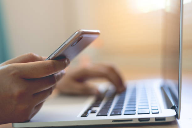 istock Woman using mobile phone to pay online shopping 1458976609