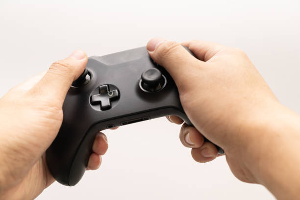 istock Black joystick in hands isolated on white background.  esport concept. 1458978610