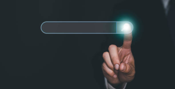 istock Businessman hand touching to search engine browser icon to input and finding new business trends. 1458984756