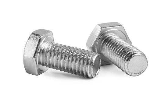 Overhead shot of screw and nail head on white background.