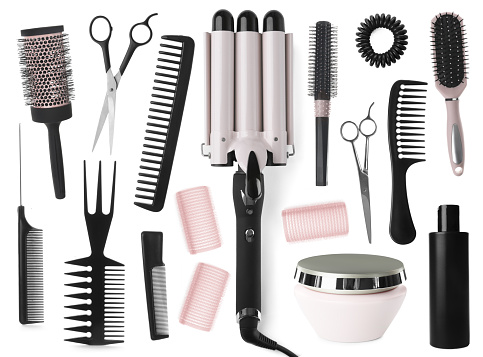 Set with professional hairdresser tools and cosmetic products on white background