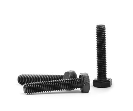 Three black metal hex bolts on white background