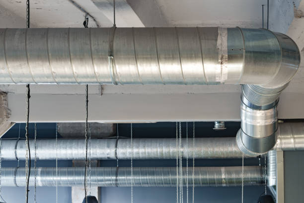 istock Silver ventilation pipes hanging from the ceiling inside the building 1458985336