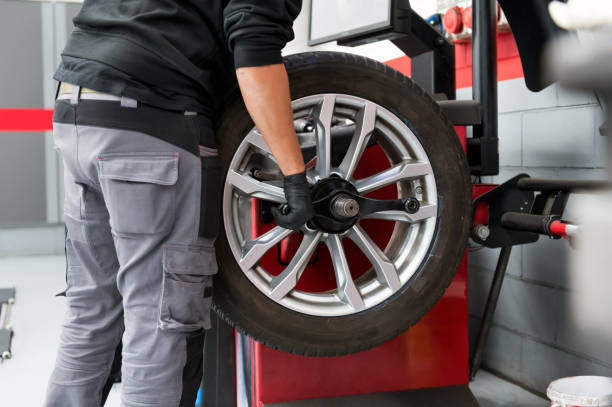 istock Crop male operator working in tire dealer workshop 1458985391
