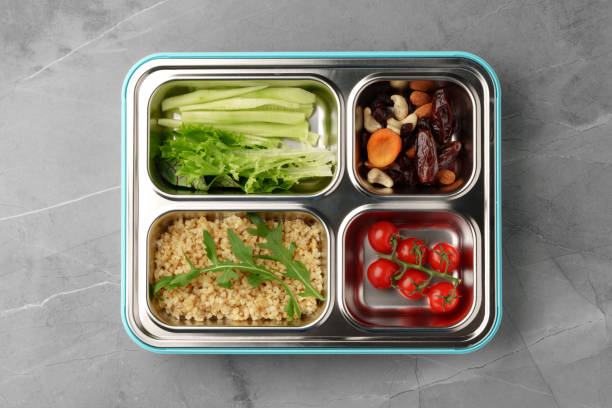istock Lunch box with ready food on gray background 1458986763
