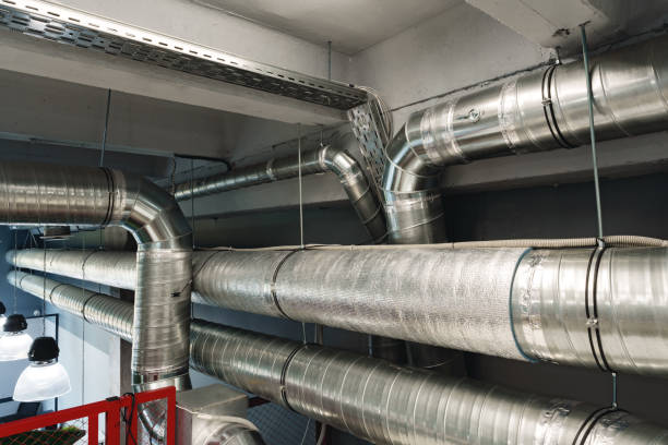 istock Silver ventilation pipes hanging from the ceiling inside the building 1458986846