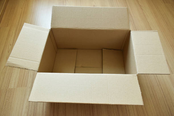 istock brown post box packaging put on wood floor 1458987398