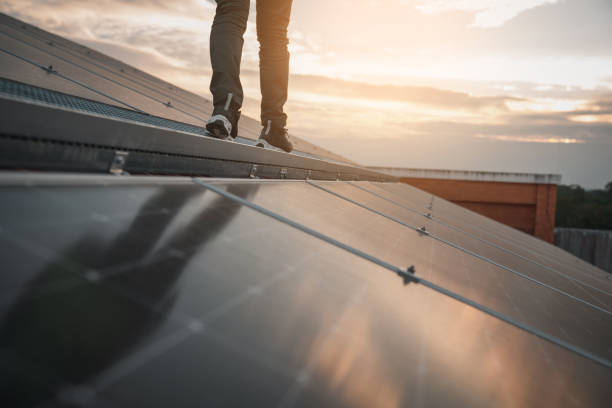 istock Service engineer checking solar cell on the roof for maintenance if there is a damaged part. Engineer worker install solar panel. Clean energy concept. 1458991086