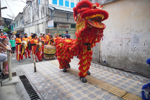 Banda Aceh, Indonesia - January 22, 2023; A lion dance performance at a monastery in celebrations lunar new year