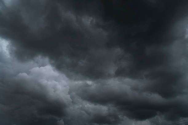 dark thunderstorm clouds rainny landscape. meteorology danger windstorm disaster climate. dramatic dark storm thundercloud rain clouds on black sky background.dark cloudscape storm disaster gray sky - cumulus cloud cloud sky only cumulonimbus imagens e fotografias de stock