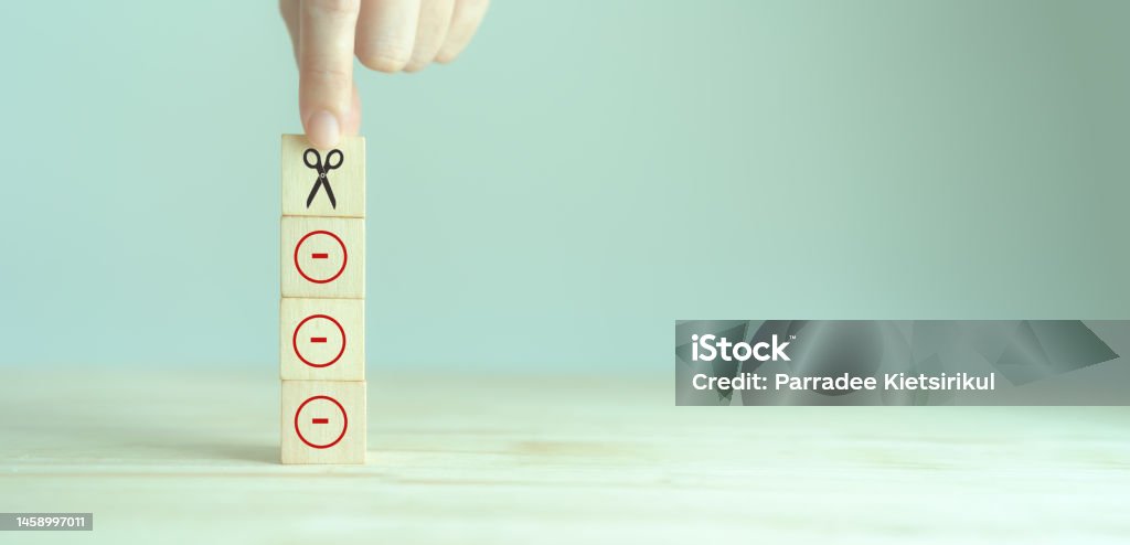 Cutting losses concept. Cut or eliminate the loss of the red minus sign to protect gains, limit losses on a security position. Investment strategy used in trading and investing. Financial management. Adversity Stock Photo