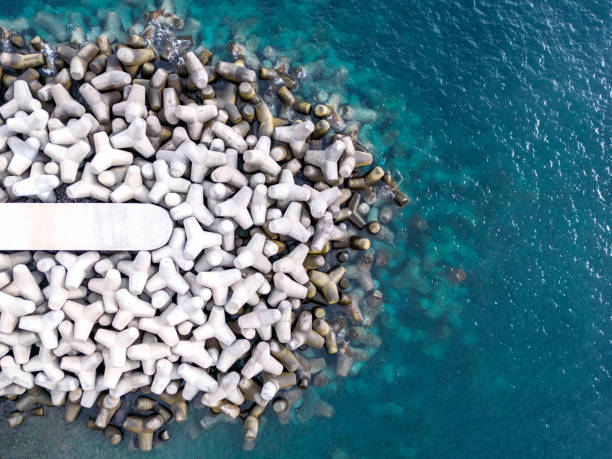 Aerial Drone View of a Concrete Breakwater. stock photo