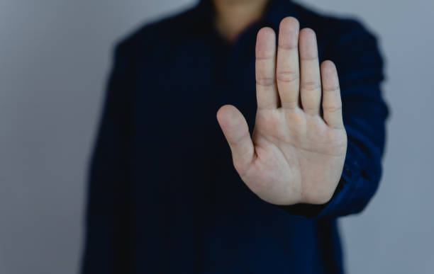 istock The man raised his hand to show a stop gesture. 1459000192