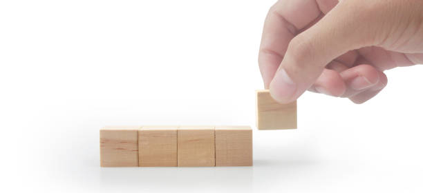 istock Wooden cubes in hand with copy space for input wording 1459004419