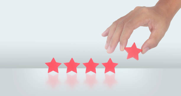 istock Rise on increasing five stars in human hand, Increase rating 1459004437