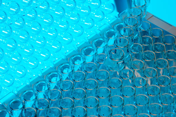 fondos de probeta en azul. - test tube glass reagent red fotografías e imágenes de stock
