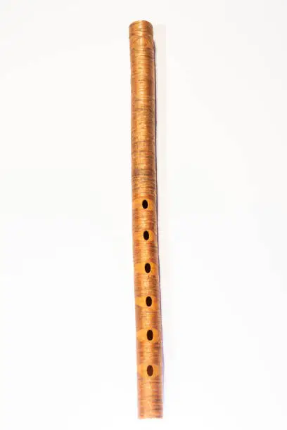 old flute musical instrument white background detail of one cultural heritage
